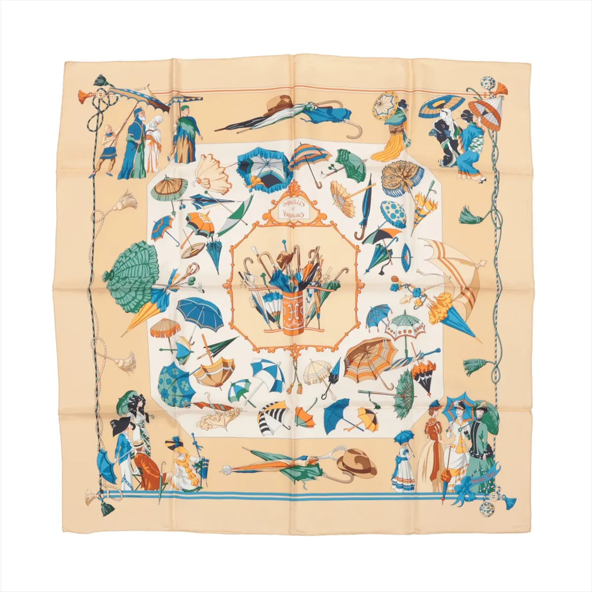 Hermès Carré 90 silk handkerchief in beige featuring a detailed "Ombrelles et Parapluies" design with colorful parasols, umbrellas, and Victorian-era figures, bordered with decorative tassels and elegant illustrations.