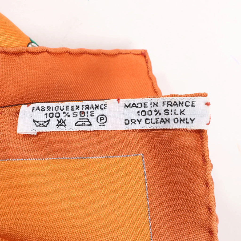 Hermès Carré 90 "PARURES DES SABLES" Silk handkerchief in Orange