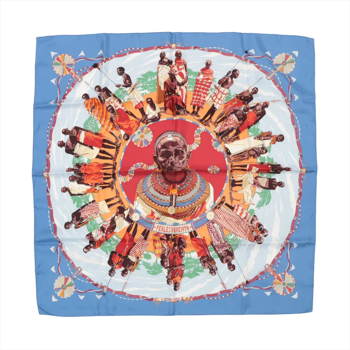 Hermès Carré 90 "Perles du Kenya" silk handkerchief in vibrant blue, showcasing a central portrait surrounded by detailed illustrations of traditionally dressed Kenyan figures, colorful beadwork, and tribal patterns on a circular layout with a bold red and white accent.