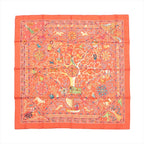 Hermès Carré 90 orange silk scarf with intricate multicolor figures, animals, floral details, and decorative border, laid flat