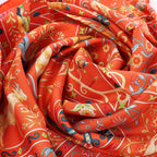 Hermès Carré 90 "Peuple du Vent" Silk handkerchief in Orange