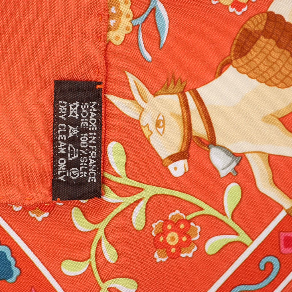 Hermès Carré 90 "Peuple du Vent" Silk handkerchief in Orange