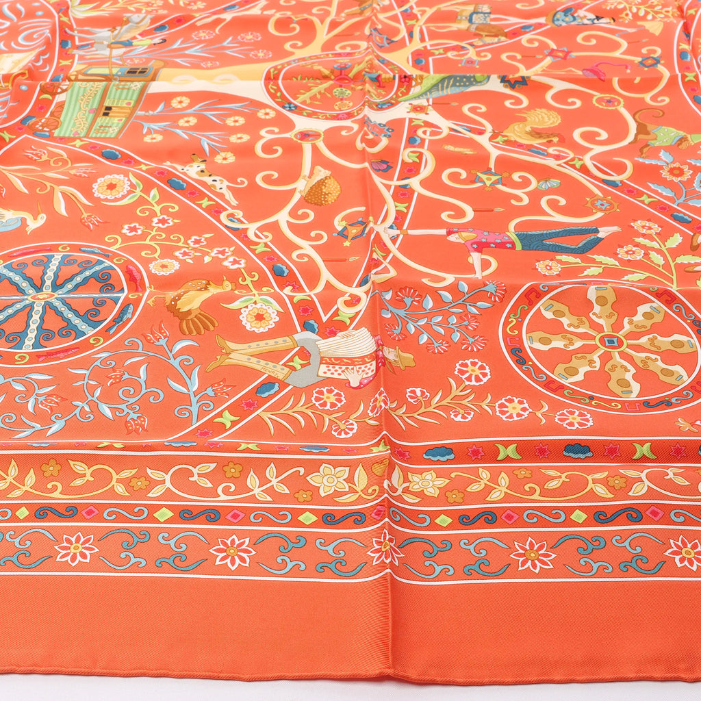 Hermès Carré 90 "Peuple du Vent" Silk handkerchief in Orange