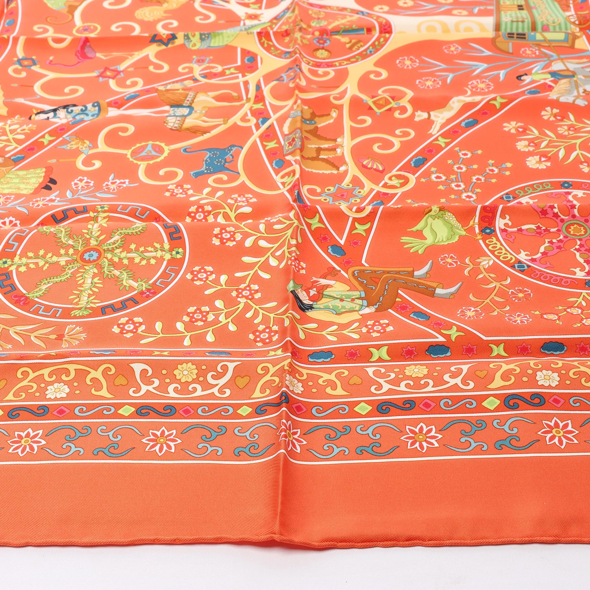 Hermès Carré 90 "Peuple du Vent" Silk handkerchief in Orange