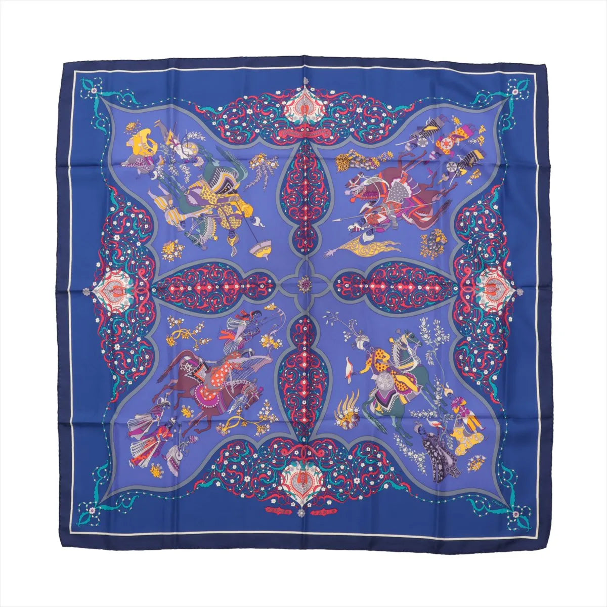 Hermès Carré 90 "Poesie Persane" silk scarf in rich blue featuring a symmetrical Persian-inspired design with ornate warriors, horses, and floral motifs in vivid red, yellow, and purple, surrounded by an elaborate patterned border.
