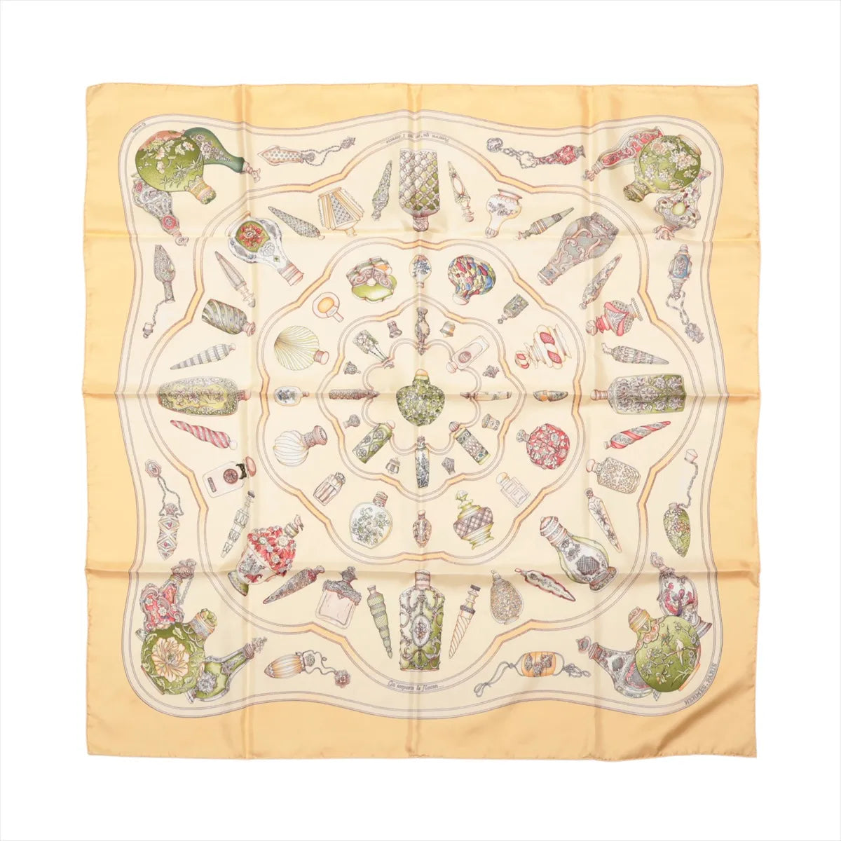 Hermès Carré 90 beige silk scarf with an ornate multicolour print of decorative perfume bottles, flacons and small accessories.