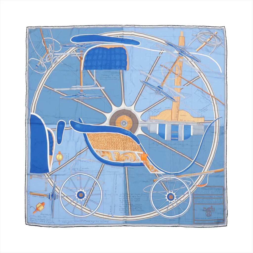 Hermès Carré 90 blue silk scarf with carriage blueprint illustration, large wheel design, and technical drawing details, laid flat