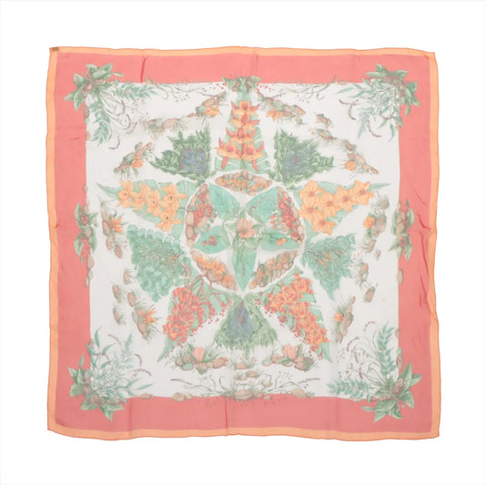 Hermès Carré 90 "Pythagore" silk handkerchief in orange featuring a symmetrical botanical design with flowers, leaves, and fruits in pastel green, orange, and red tones on a white background with a coral-orange border.