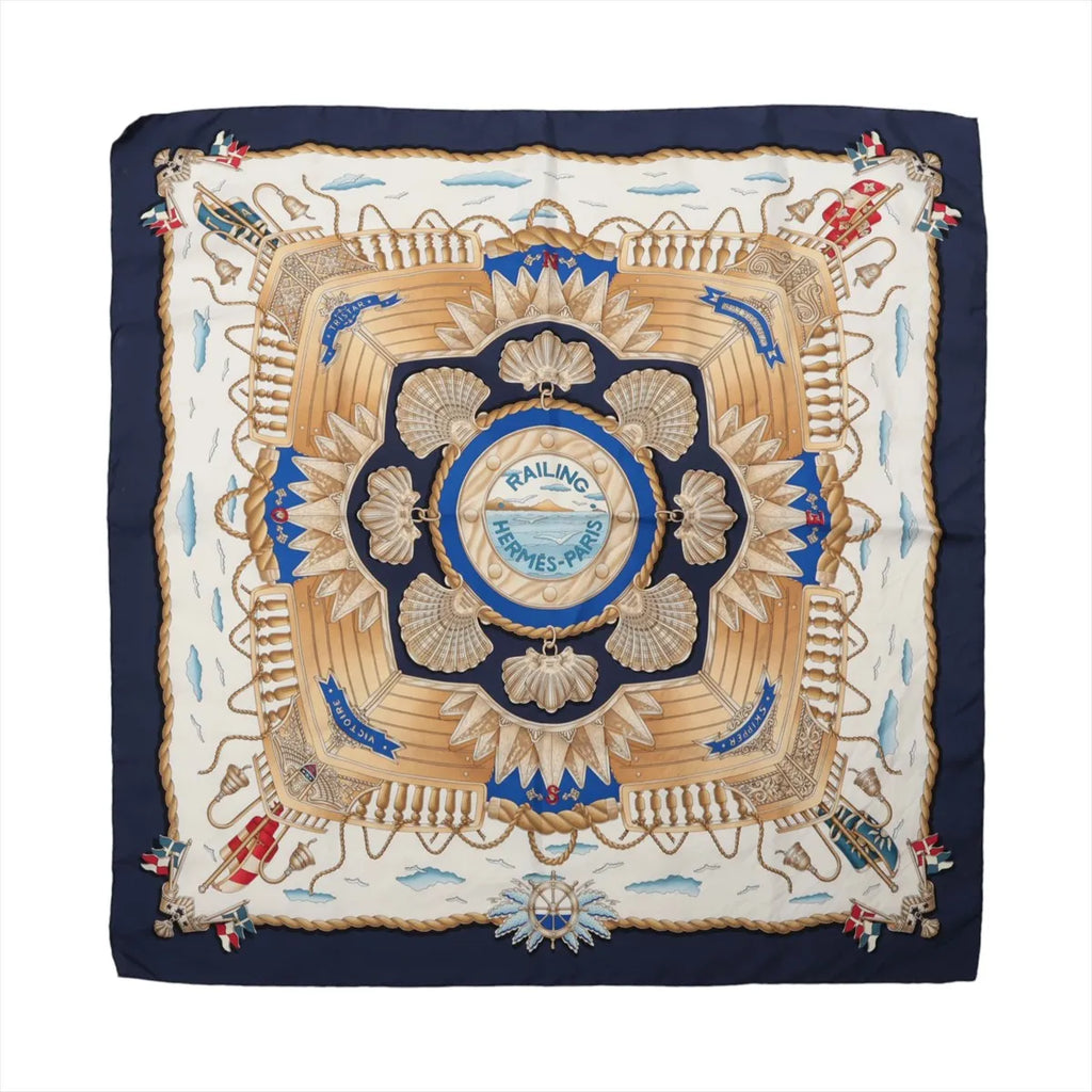 Hermès Carré 90 "RAILING" silk handkerchief in navy blue, featuring a symmetrical maritime-inspired print with ropes, shells, ships, and a central “Hermès-Paris” emblem, displayed flat against a white background.