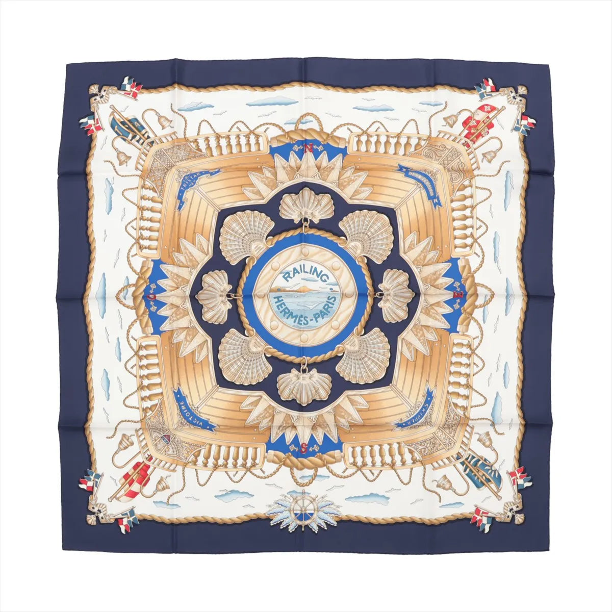 Hermès Carré 90 "RAILING" silk handkerchief in navy blue featuring a central ship deck motif with beige railings, scallop shells, golden ropes, and maritime flags on a nautical-themed background with clouds and waves.