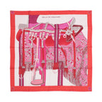 Hermès Carré 90 pink silk scarf with detailed red and magenta saddle illustration, fringe and tack details, and a red dotted border on white background