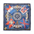 Hermès Carré 90 "SEXTANTS" silk scarf in blue featuring a central compass design surrounded by gold sextants, nautical flags, and directional markings, all bordered with a navy and gold frame.