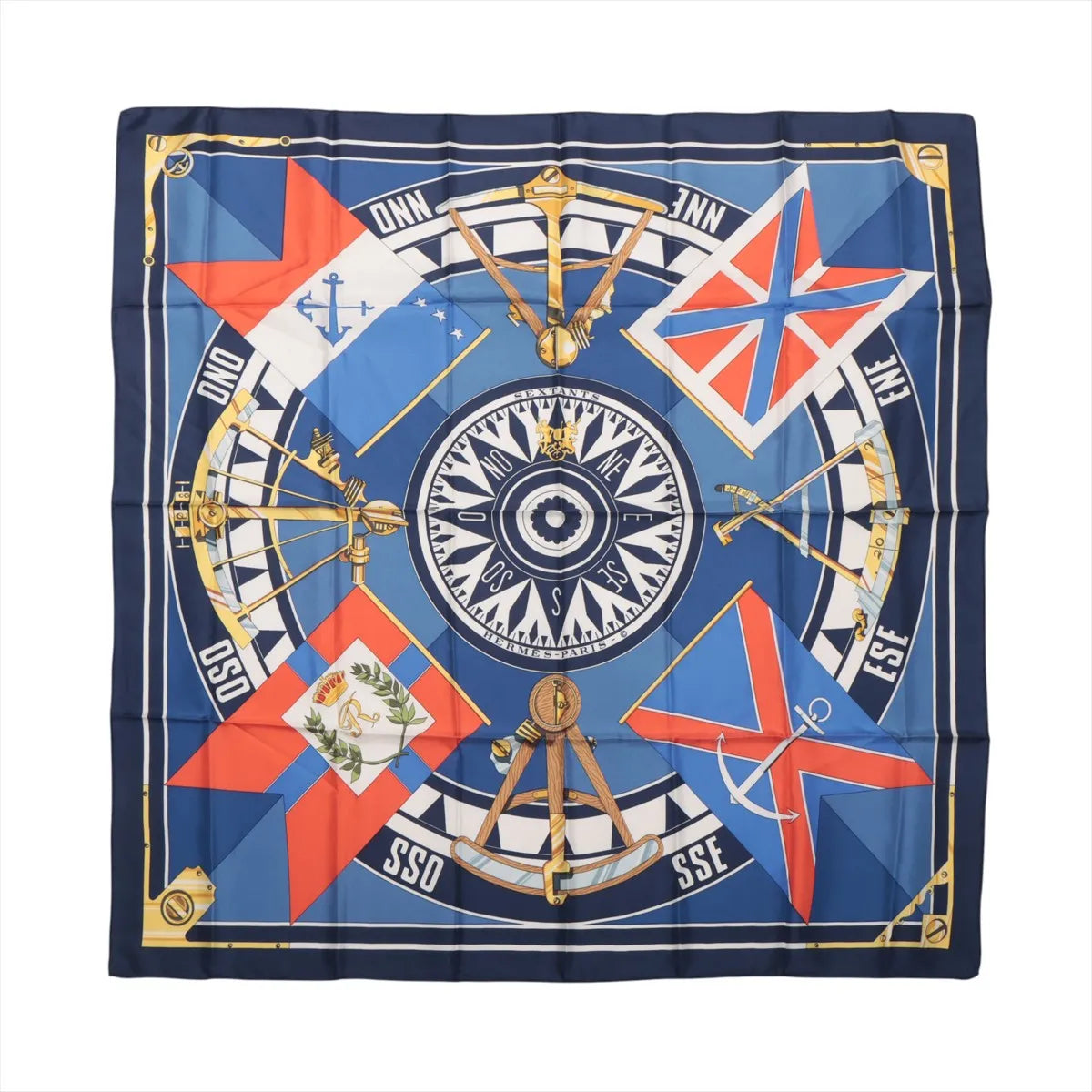 Hermès Carré 90 "SEXTANTS" silk scarf in blue featuring a central compass design surrounded by gold sextants, nautical flags, and directional markings, all bordered with a navy and gold frame.