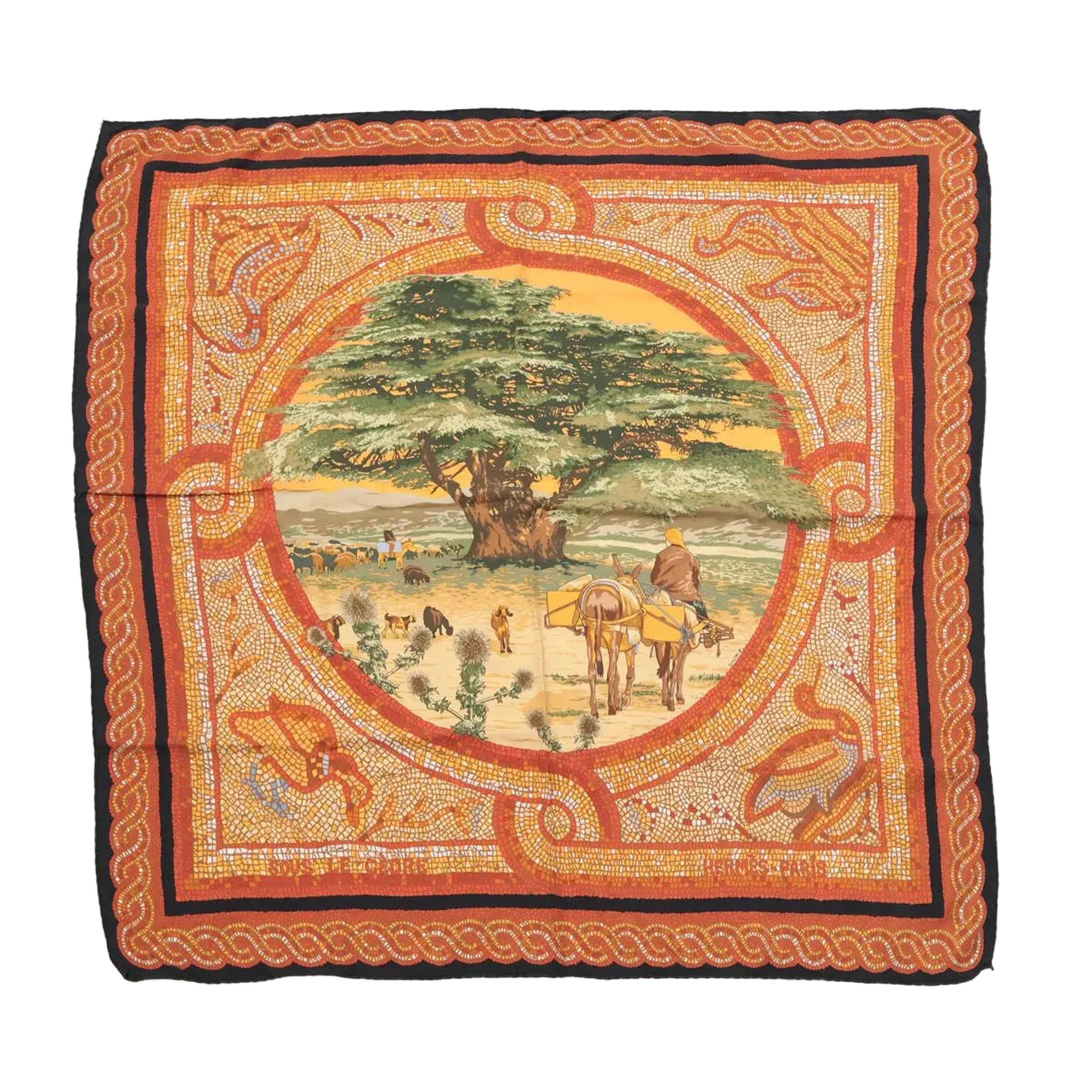 Hermès Carré 90 “Sous Le Cèdre” silk scarf in brown with orange mosaic-style border and central pastoral scene with a large cedar tree, laid flat on white background.