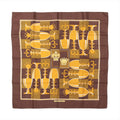 Hermès Carré 90 "ÉCHIQUIER" silk scarf in brown, featuring a symmetrical chessboard-inspired design with alternating light and dark squares, yellow and gold chess pieces, and two central crown emblems in the middle.