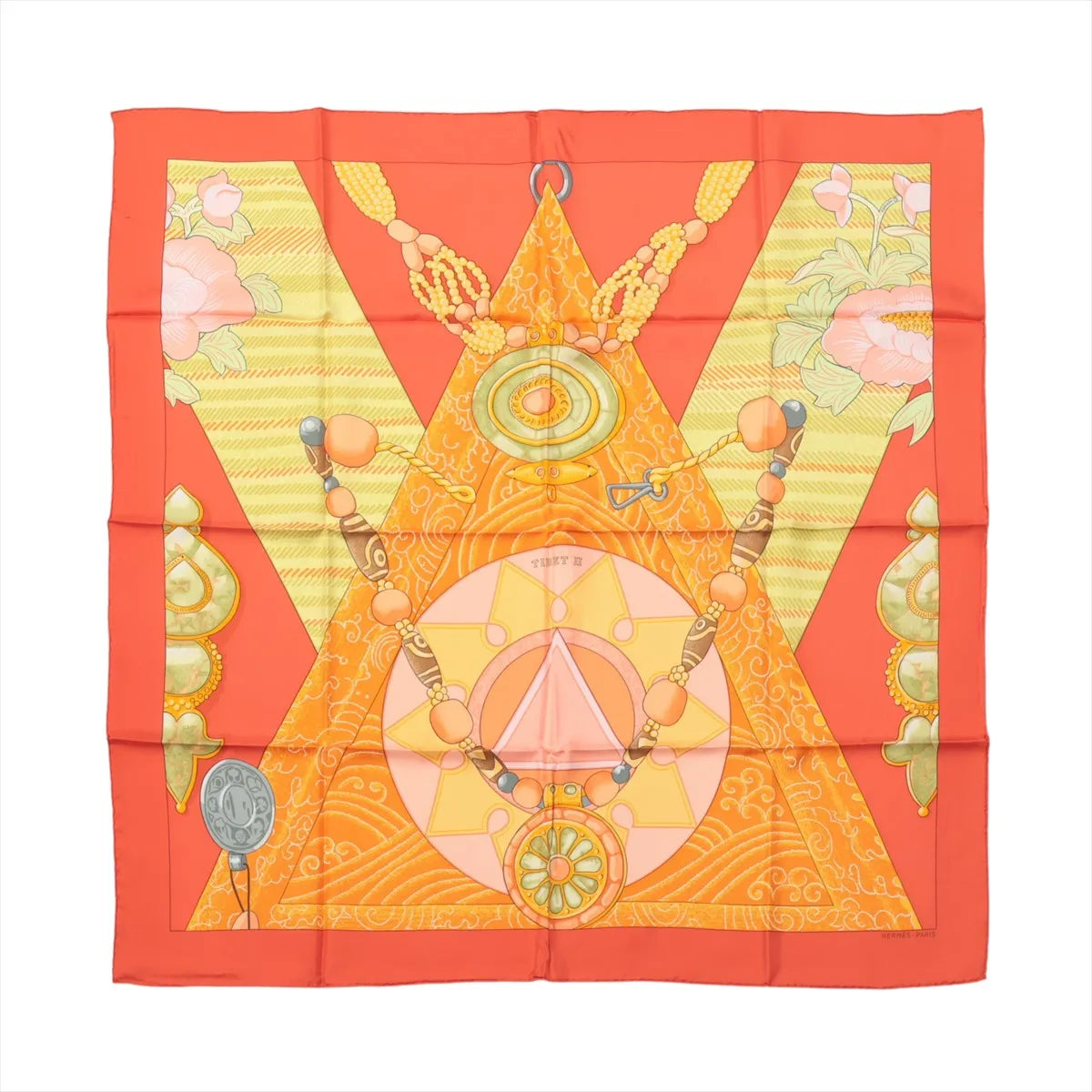 Hermès Carré 90 "Tibet" silk scarf in vibrant orange featuring geometric and spiritual symbols, including mandalas, beads, and floral accents, inspired by Tibetan culture and tradition.