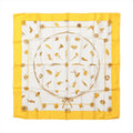 Hermès Carré 90 "Clips" silk handkerchief in yellow featuring gold-tone jewelry and brooch motifs on a white background with a vibrant yellow border.