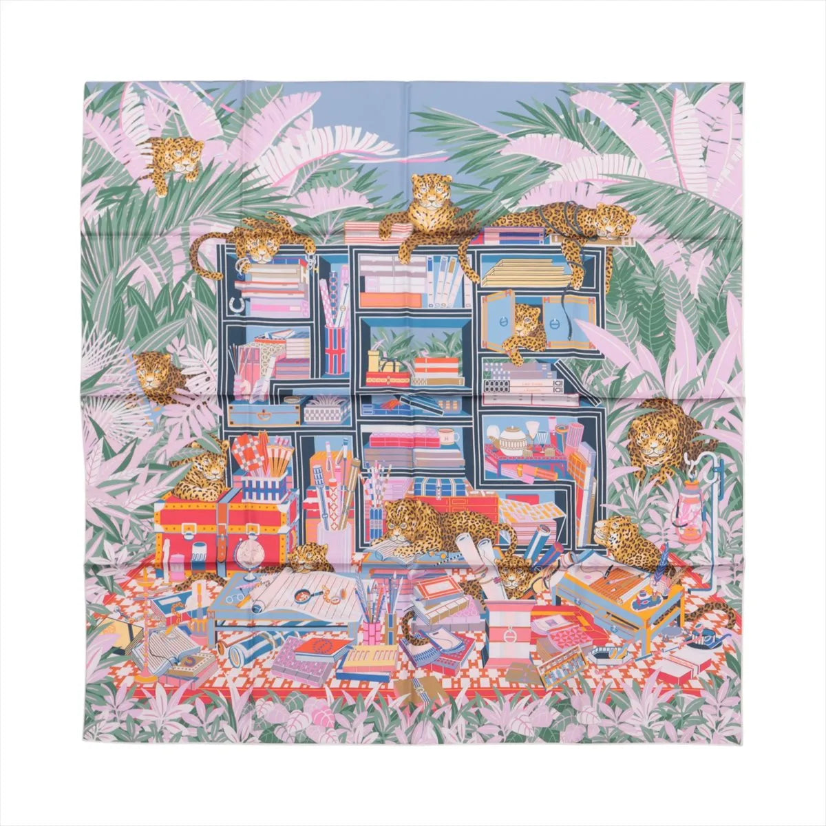 Hermès Carré 90 Double Face “Les Douze Léopards” silk scarf in multicolor, showcasing twelve leopards lounging among vibrant books, trunks, and foliage with a playful jungle theme.