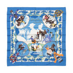 Blue Hermès Carré 90 square scarf with “Feria de Sevilla” illustration of horses, riders and dancers, framed by a bold blue border and Hermès Paris label.
