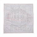 Hermès Carré Géant “Pique Sellier” gray cashmere-silk scarf with multicolor line drawing of a building, red border, and “Hermès Paris” text
