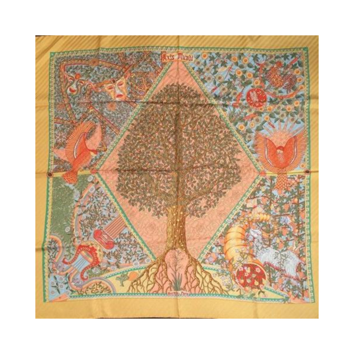 Hermès Axis Mundi square scarf laid flat, featuring a central tree with exposed roots, birds and floral motifs, framed by a golden-orange border.