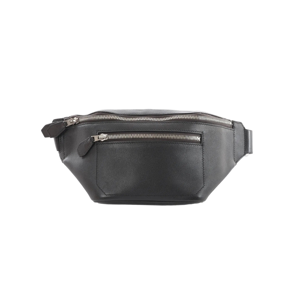 Hermès Cityslide Cross PM black leather belt bag with two zip compartments and silver-tone zippers on a white background.