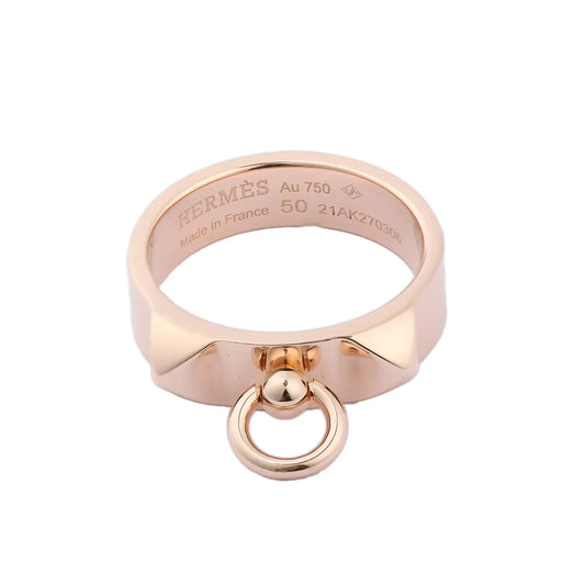 Hermès Collier de Chien ring in 18K pink gold featuring pyramid studs and signature dangling ring detail, engraved interior showing size 50 and hallmark.