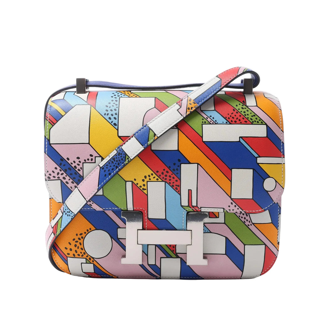 Hermès Constance 3 24 crossbody bag in multicolor printed leather with a shoulder strap, flap closure and silver-tone H clasp.