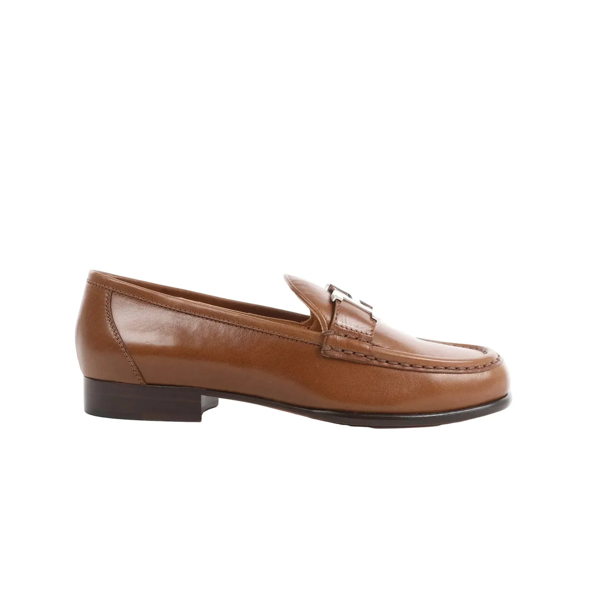 Side view of a brown Hermès Constance leather loafer with signature H hardware detail and low stacked heel, size 36 EU.