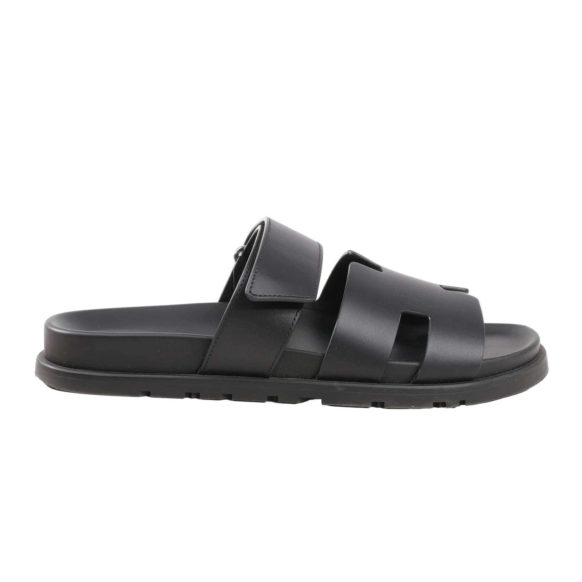 HERMÈS Cypre Sandals in black smooth leather, size 42 EU, featuring a wide cutout strap design, adjustable velcro strap, and flat sole, displayed on a white background.