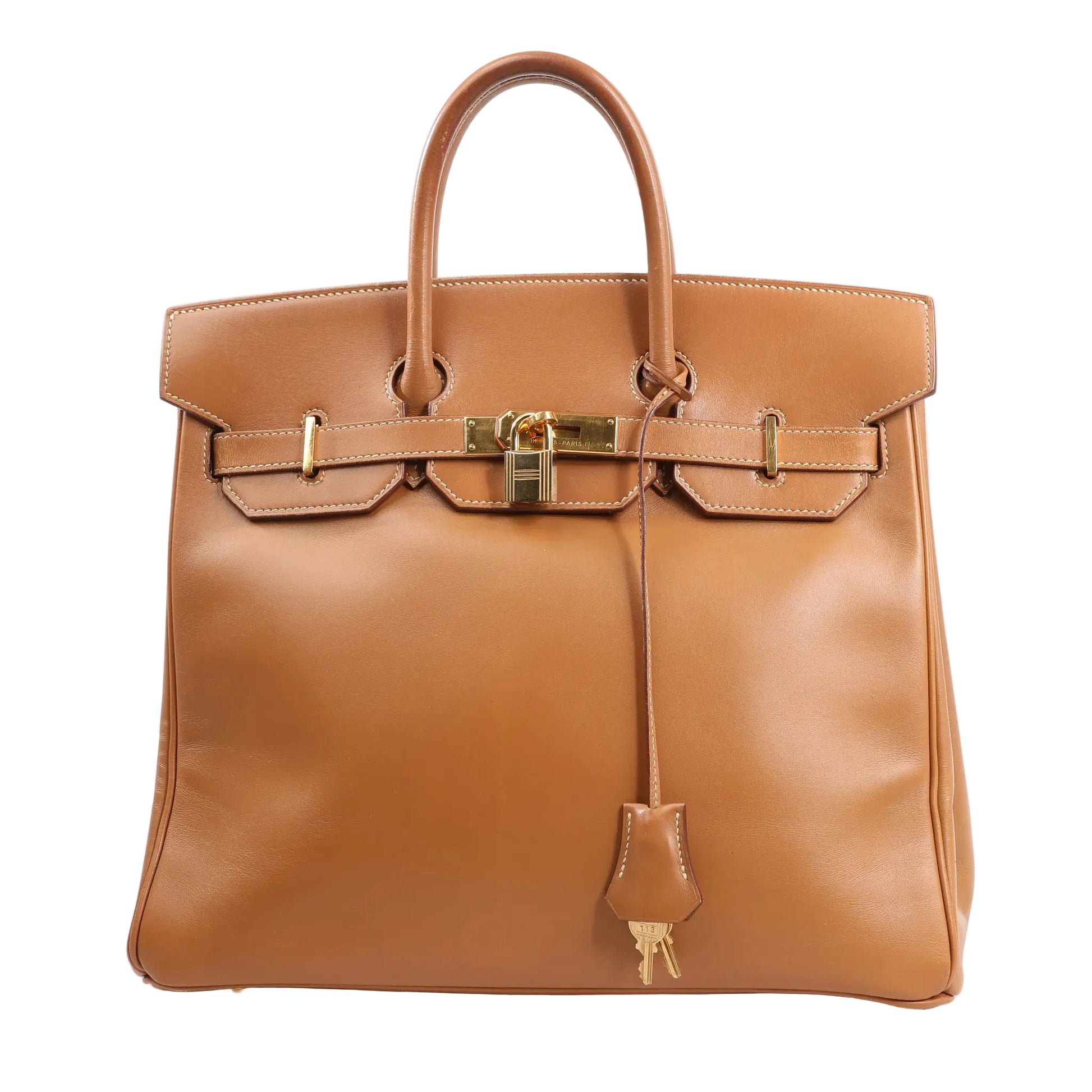 Front view of the Hermès Haut à Courroies 32 handbag (○Y:1995) in smooth brown Vache leather, featuring structured top handles, flap closure with gold-tone hardware, lock and keys in clochette, and classic stitching details.