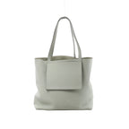 Light gray Hermès Cabasellier 46 pebbled leather tote with long shoulder handles, open top and large rectangular front pocket.
