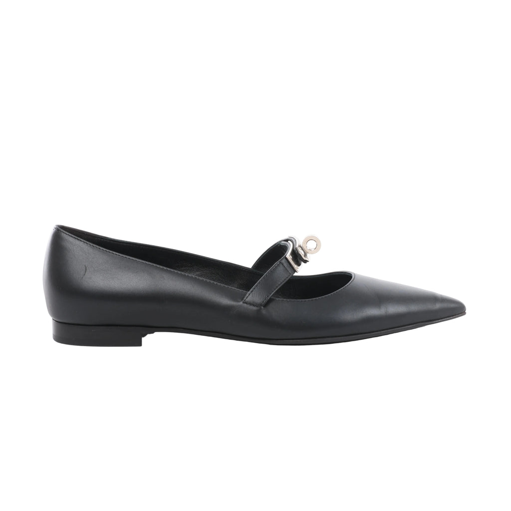Side view of a black Hermès leather ballet flat with a pointed toe, low heel and slim instep strap featuring silver-tone Kelly hardware.