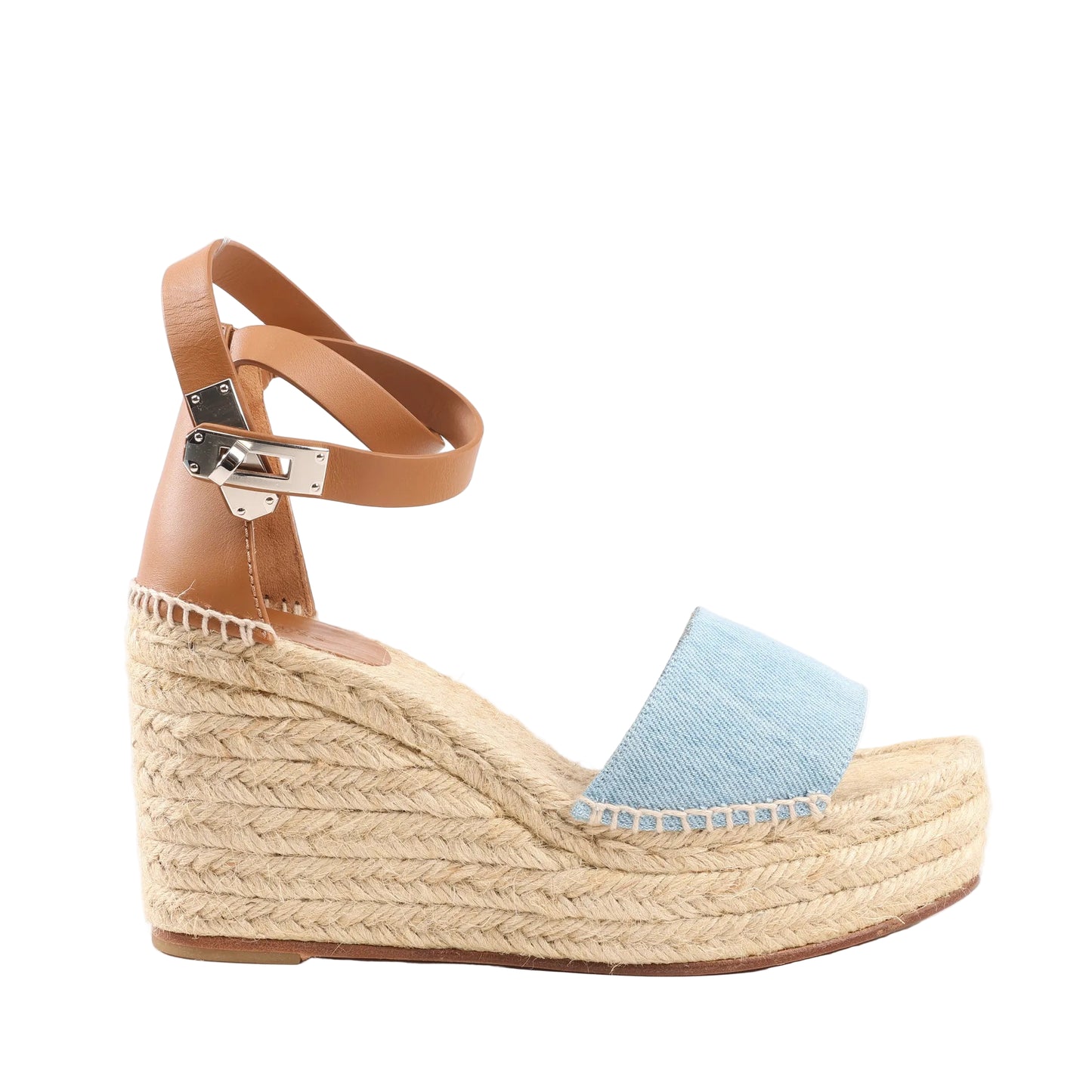 Hermès Kelly Tivoli wedge espadrille sandals in light blue denim with beige woven jute platform sole, tan leather ankle strap, and silver-tone Kelly buckle clasp.