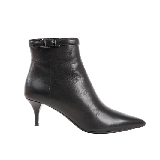 Hermès ankle boots in smooth black leather featuring a pointed toe, slim mid-height stiletto heel, and a black H-shaped buckle strap around the ankle. Size 38.5 EU.