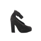 Black suede platform heel with wide ankle strap buckle and tall block heel on white background