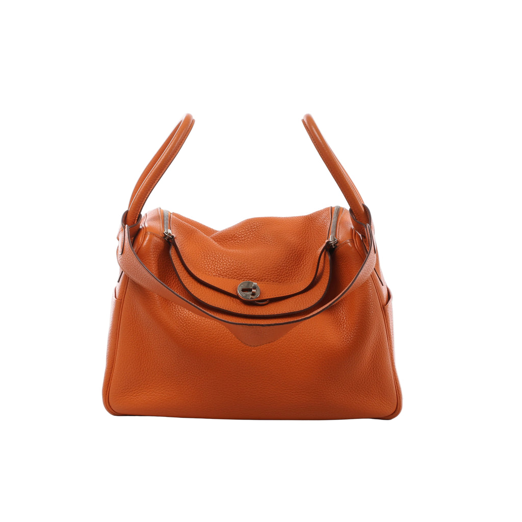 Orange Hermès Lindy 34 Taurillon Clemence leather handbag with dual handles, shoulder strap, flap closure and silver-tone hardware.