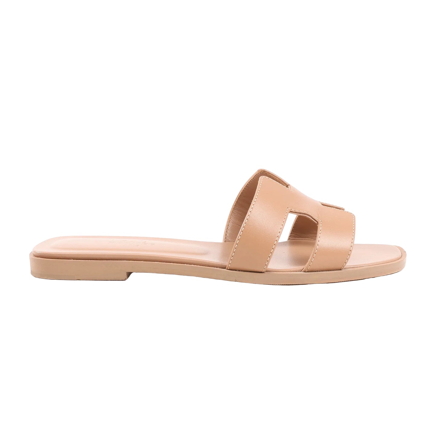 HERMÈS Oran Sandals in beige leather, size 36.5 EU, with flat sole and signature “H” cut-out strap design, displayed on a white background.