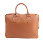 HERMÈS Plume 40 handbag in gold Evercolor leather with double top handles, white contrast stitching, and silver-tone hardware, shown upright against a white background.