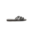 Black Hermès Rivage rubber slide sandal with chain-link style straps on a white background.