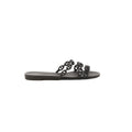 Black Hermès Rivage rubber slide sandal with chain-link style straps on a white background.