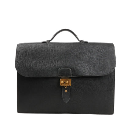 Hermès Sac à Dépêches 38 handbag in black Ardennes leather, featuring a structured rectangular shape, single top handle, flap closure with gold-plated push-lock, and fine grained texture.