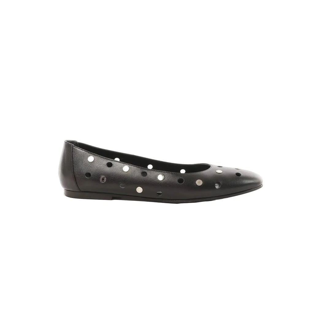 Black Hermès Serie leather ballet flat with circular cutouts and silver-tone button-style studs, shown in side profile on a white background.