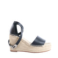 Hermès Tivoli wedge sandal with black leather straps, beige woven espadrille platform sole and polished silver-tone buckle hardware.