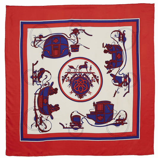 Hermès Carré 90 "Ex Libris" silk scarf featuring red, navy, and white tones with symmetrical carriage illustrations and an ornate central medallion, framed by a bold red border.