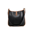 Hermès Evelyne I shoulder bag in black grained leather with brown trim, perforated H motif, dark shoulder strap and gold-tone hardware.