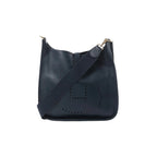 Hermès Evelyne I 33 GM in dark navy leather with perforated H logo and wide shoulder strap with gold-tone clip, shown on white background