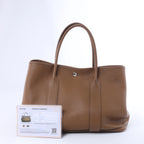 Bolso de mano HERMES 24/24 29 Togo de piel con detalles metálicos negros y dorados D: 2019