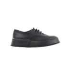 Black Jil Sander leather lace-up sneaker with smooth upper, tonal laces, and thick platform-style rubber sole, shown in side profile.