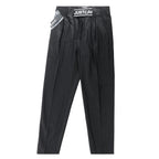 Just Cavalli black pinstripe trousers with branded “JUST CAVALLI” waistband detail, laid flat on white background.